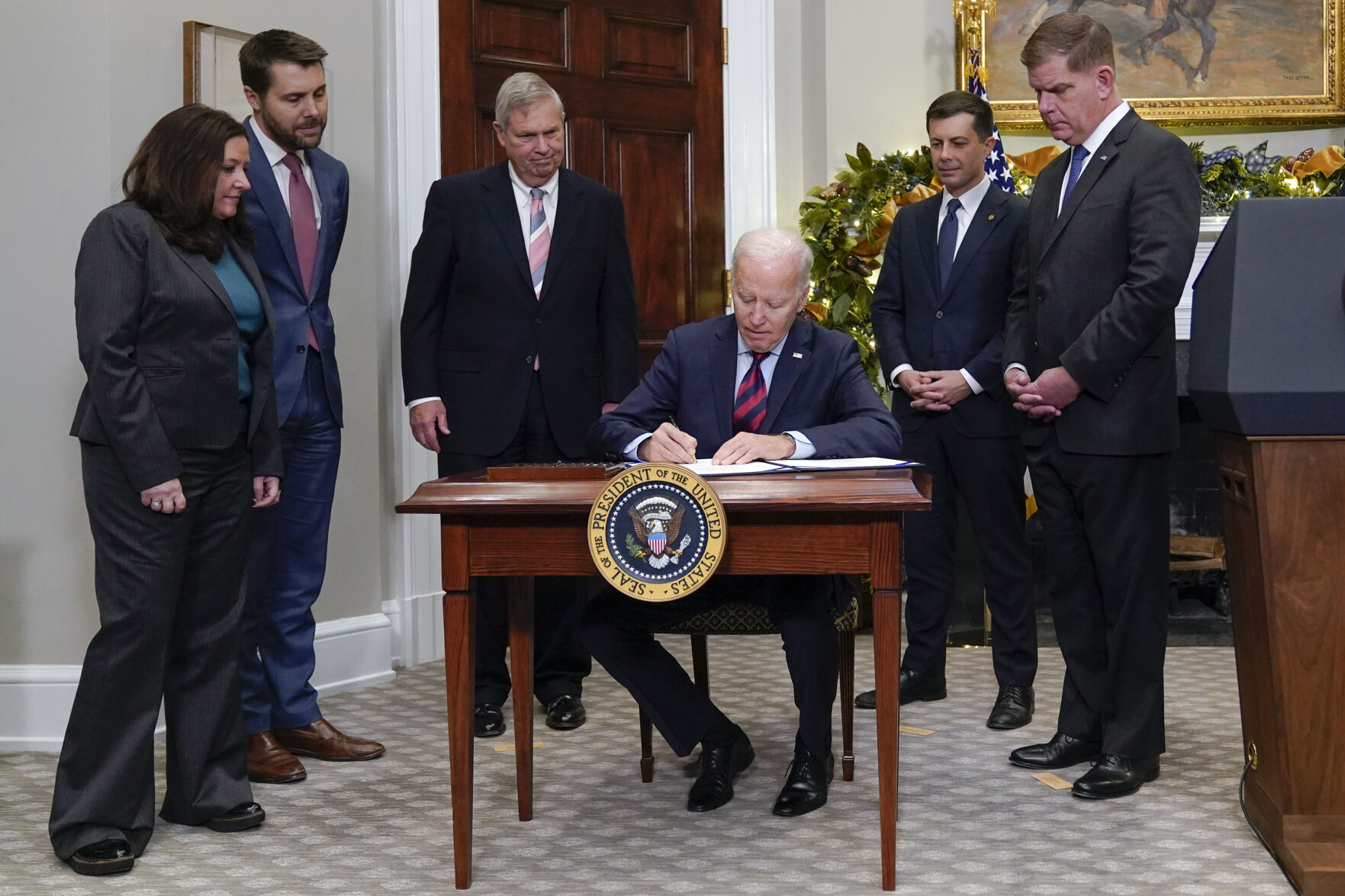 Biden signs legislation to avert rail shutdown